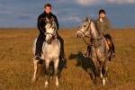 Couple Horseback Riding